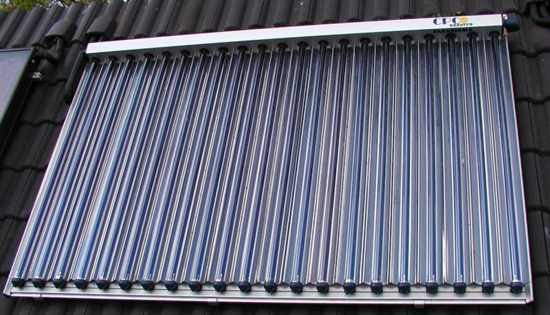 Solar thermal collection tubes mounted on the roof of a house. These should be on nearly every rooftop.